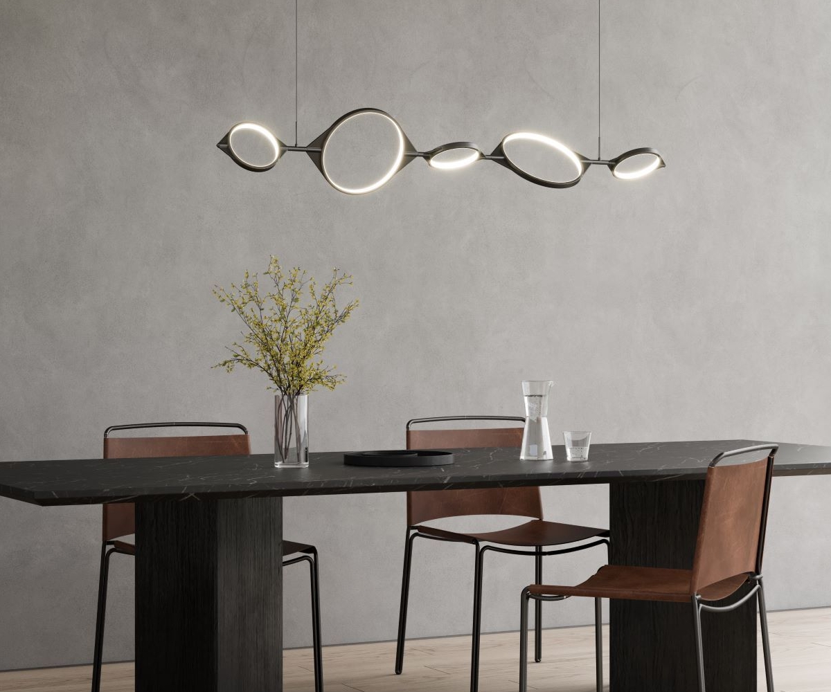 Serif LED Linear Suspension over a dining table.